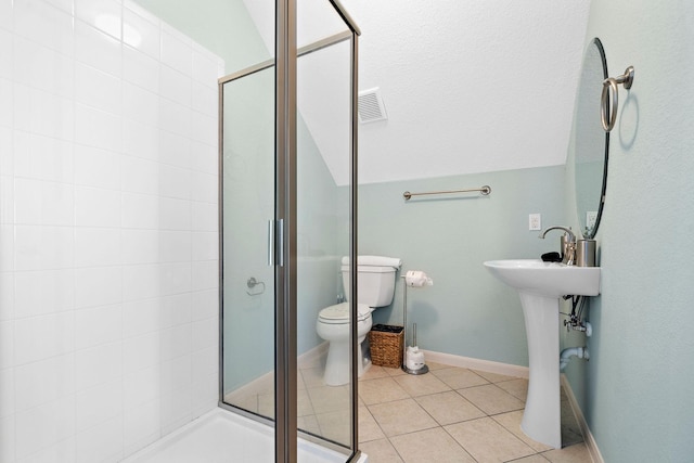 3418 Miramar Dr, Shoreacres, TX 77571 - bathroom featuring tile patterned floors, vaulted ceiling, a shower with door, and toilet