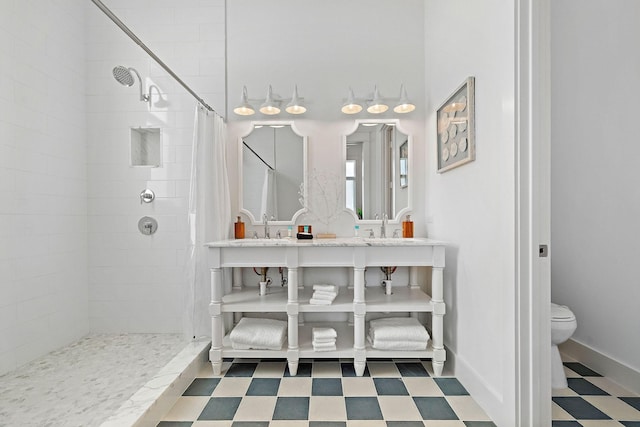 bathroom featuring sink, toilet, and walk in shower