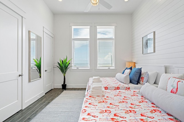 bedroom with dark wood-type flooring and ceiling fan