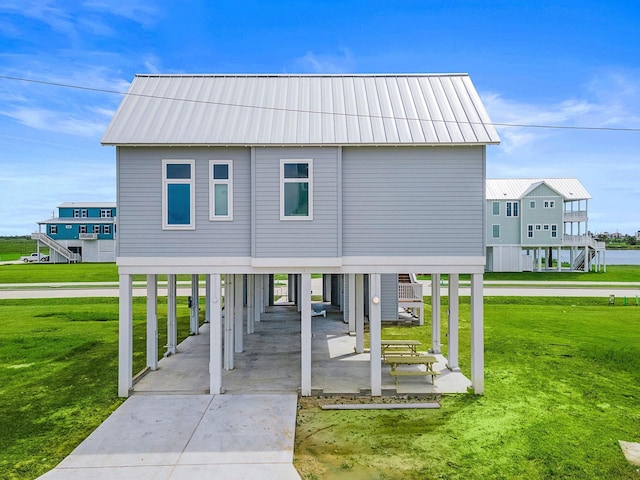 coastal inspired home featuring a front yard