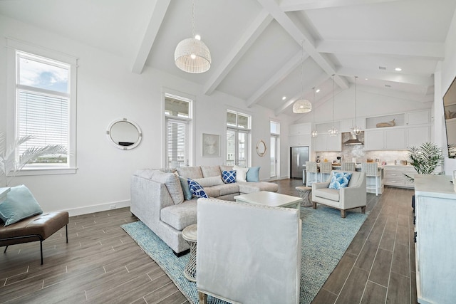 living room with beamed ceiling and high vaulted ceiling