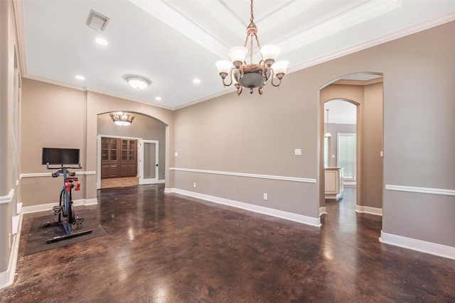 living room featuring crown molding, an inviting chandelier, and a tray ceiling