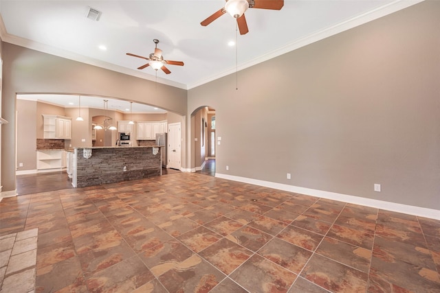 unfurnished living room featuring crown molding and ceiling fan