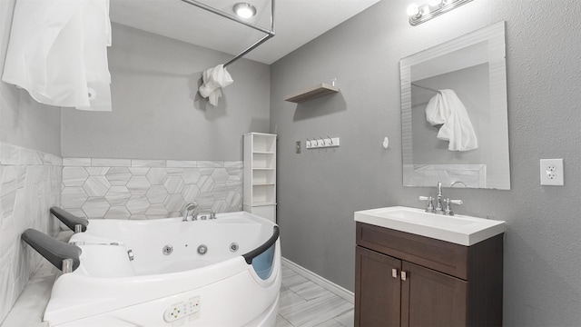 bathroom with vanity and a bath