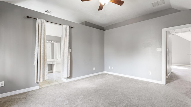 unfurnished room featuring lofted ceiling, light colored carpet, and ceiling fan