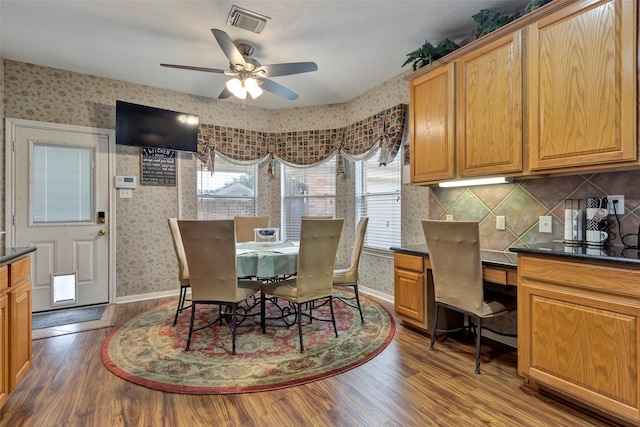 dining area featuring hardwood / wood-style floors and ceiling fan