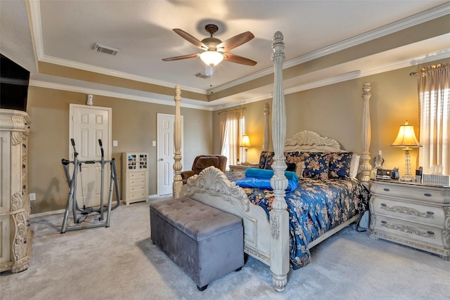 bedroom with crown molding, carpet floors, a raised ceiling, and ceiling fan