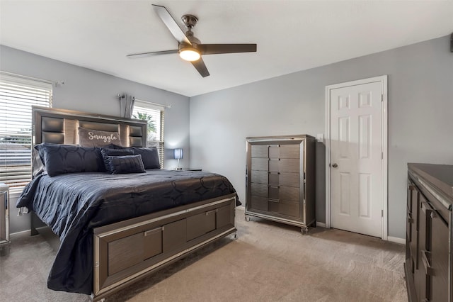 bedroom with light carpet and ceiling fan