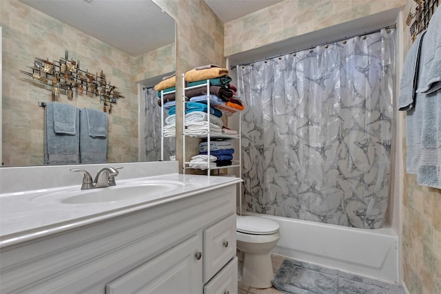 full bathroom featuring vanity, shower / tub combo, and toilet