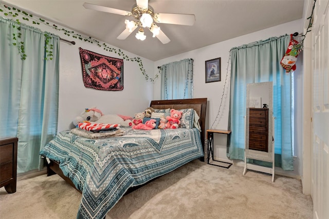 carpeted bedroom with ceiling fan