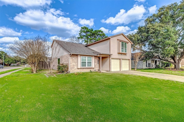 view of front of property featuring a garage and a front yard