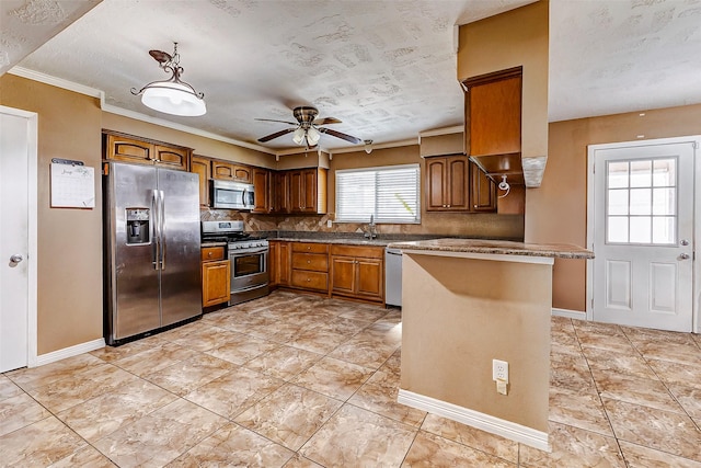 kitchen with crown molding, ceiling fan, appliances with stainless steel finishes, backsplash, and kitchen peninsula