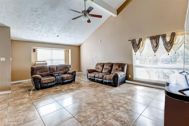 living room with plenty of natural light, high vaulted ceiling, beamed ceiling, and ceiling fan