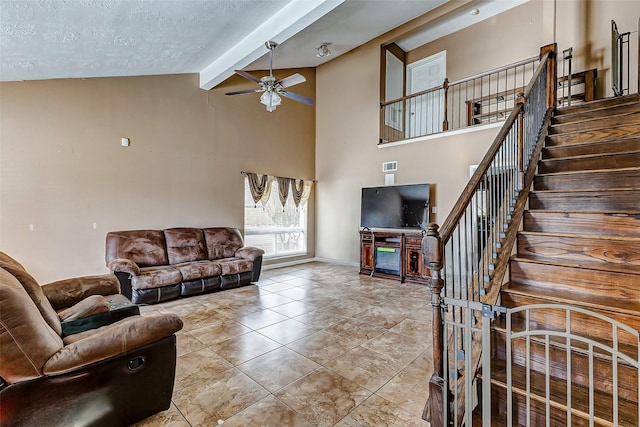 tiled living room with high vaulted ceiling, a fireplace, beamed ceiling, ceiling fan, and a textured ceiling