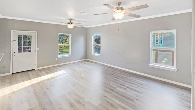 empty room featuring crown molding, ceiling fan, and light wood-type flooring