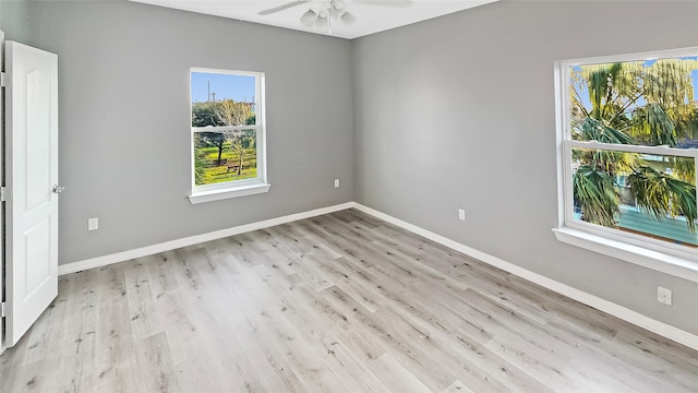 empty room featuring ceiling fan and light hardwood / wood-style floors