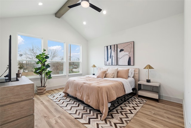 bedroom with high vaulted ceiling, beam ceiling, light hardwood / wood-style floors, and ceiling fan