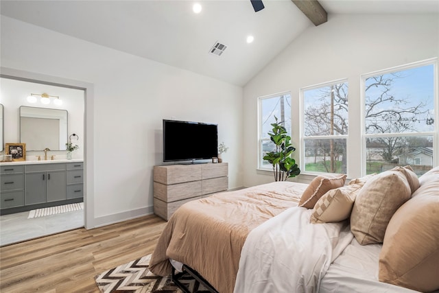 bedroom with ensuite bathroom, high vaulted ceiling, beamed ceiling, ceiling fan, and light hardwood / wood-style floors