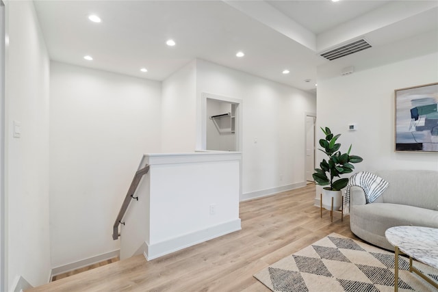 sitting room featuring light hardwood / wood-style flooring