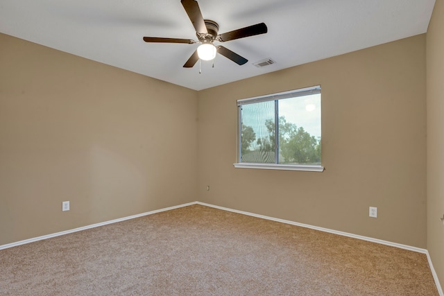 carpeted empty room with ceiling fan