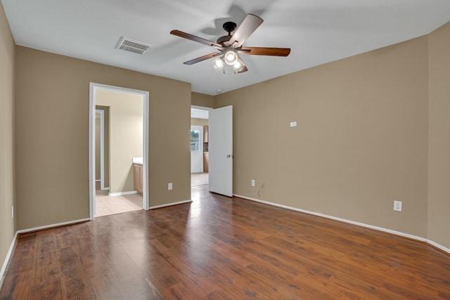 empty room featuring ceiling fan and light wood-type flooring