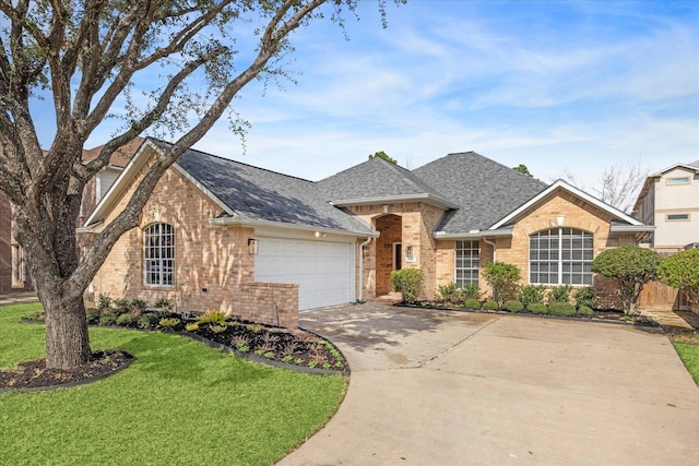 ranch-style home featuring a garage and a front lawn