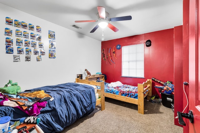 carpeted bedroom featuring ceiling fan