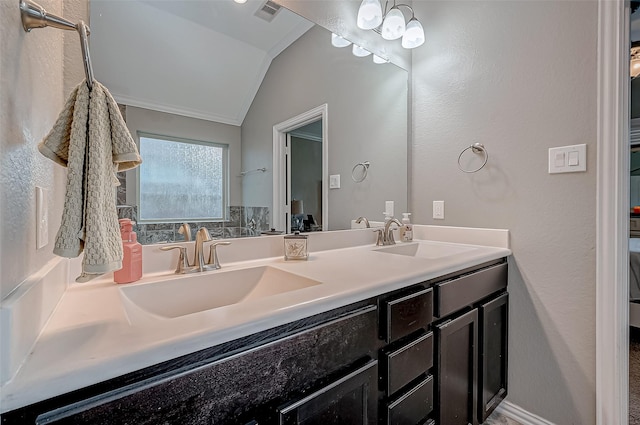 bathroom featuring lofted ceiling and vanity