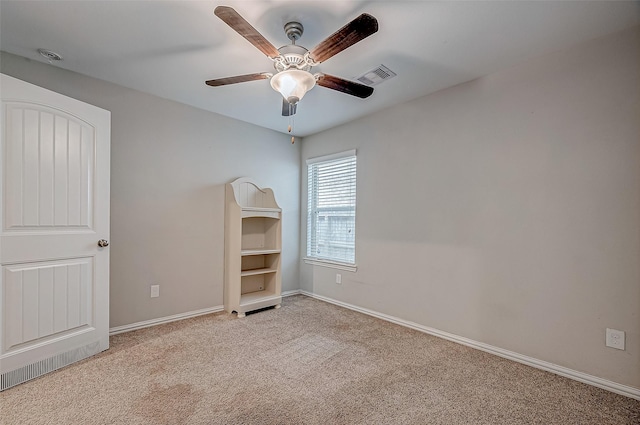 unfurnished bedroom featuring ceiling fan and light carpet