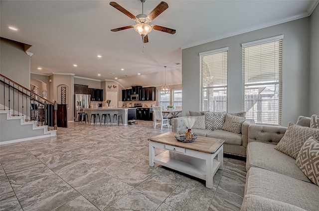 living room featuring ornamental molding and ceiling fan