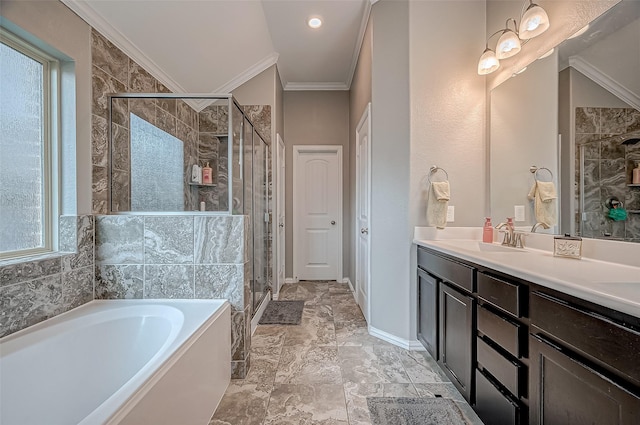 bathroom with ornamental molding, separate shower and tub, and vanity