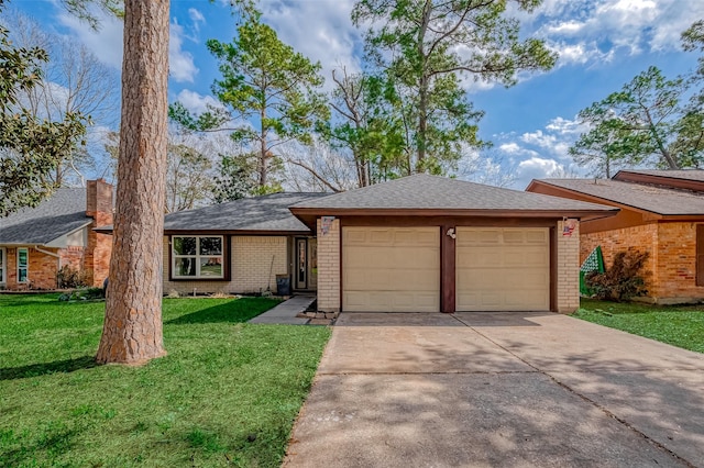 ranch-style house with a garage and a front yard