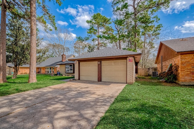 ranch-style home featuring a front lawn and central air condition unit