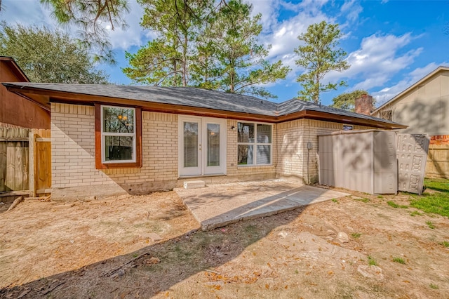 back of property with a patio area and french doors