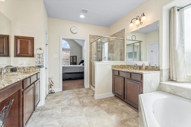 bathroom featuring vanity, shower with separate bathtub, and vaulted ceiling