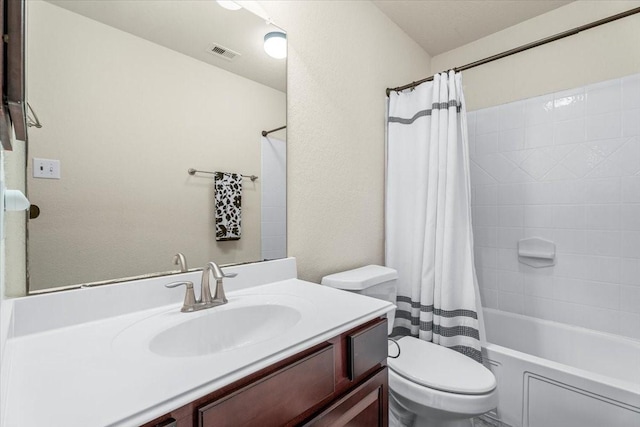 full bathroom with shower / bath combo, vanity, and toilet