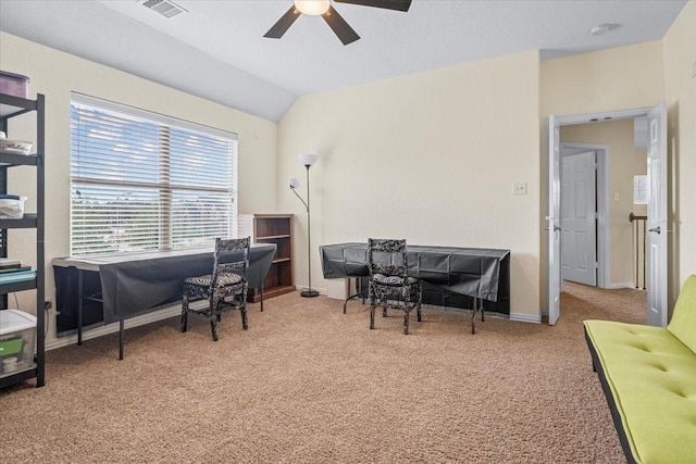 home office featuring ceiling fan, light colored carpet, and vaulted ceiling