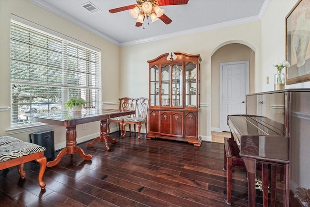 interior space featuring ceiling fan, ornamental molding, and dark hardwood / wood-style floors