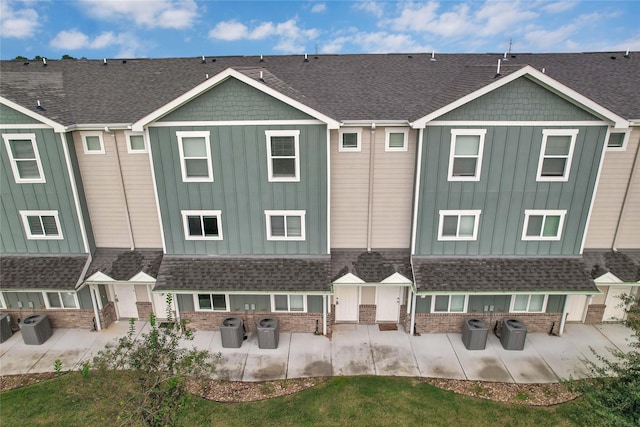 rear view of property featuring a patio and central AC unit