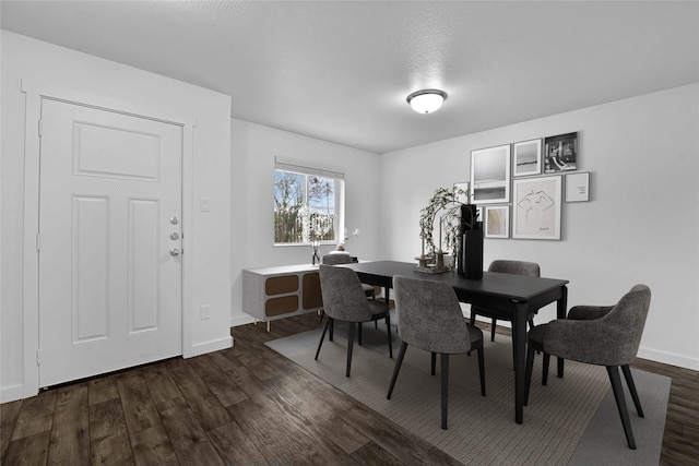 dining space featuring dark hardwood / wood-style flooring