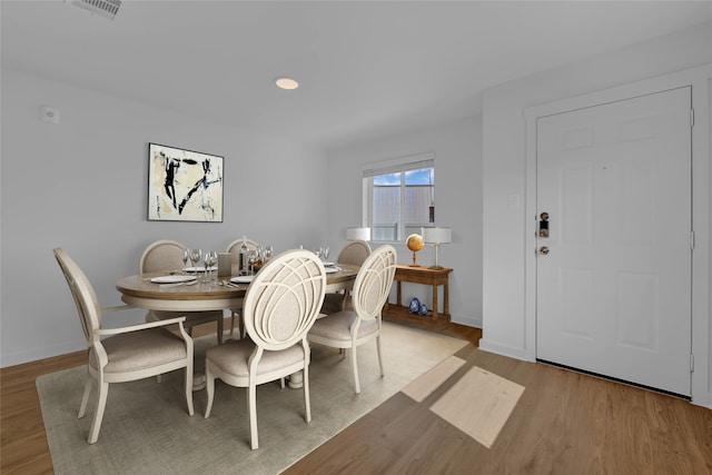 dining area featuring light wood-type flooring