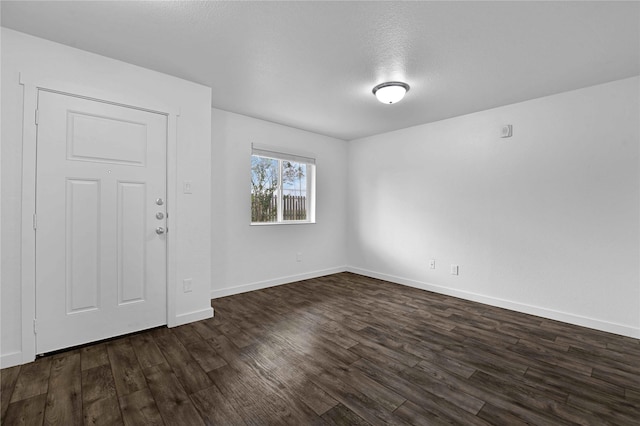 spare room with dark hardwood / wood-style floors