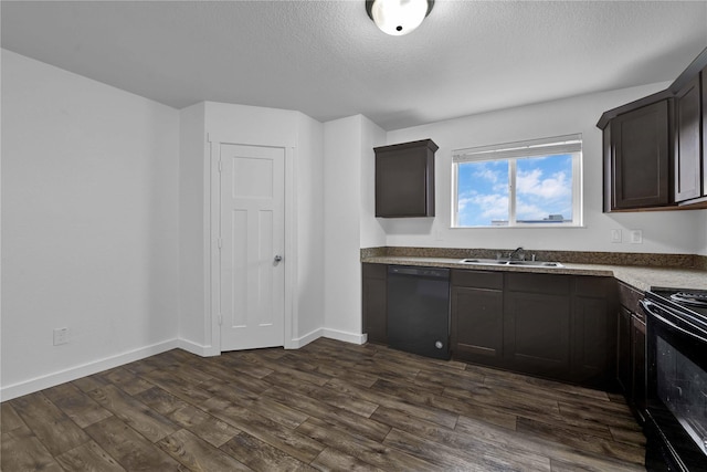 kitchen featuring sink, dark brown cabinets, black appliances, a textured ceiling, and dark hardwood / wood-style flooring