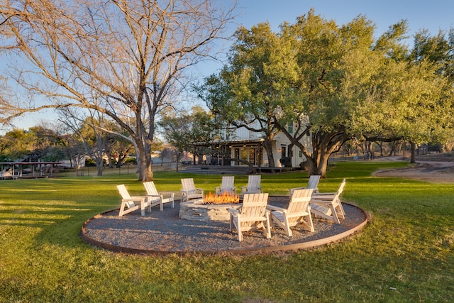 view of yard with an outdoor fire pit