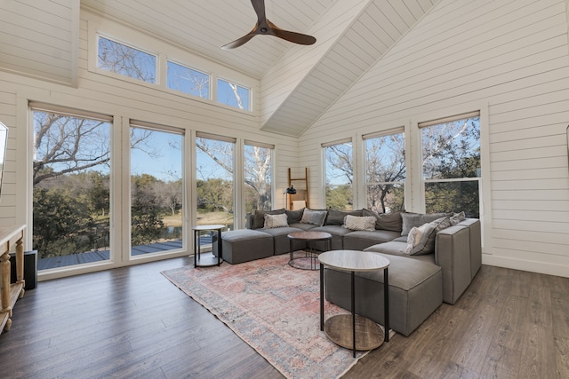 sunroom with wood ceiling, vaulted ceiling, and ceiling fan