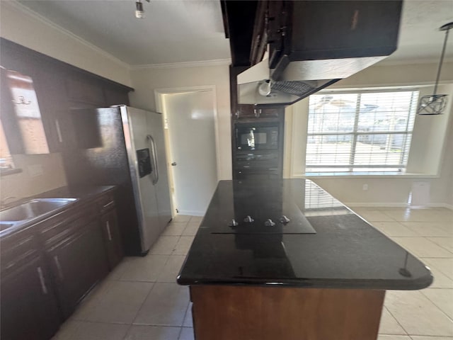 kitchen featuring decorative light fixtures, sink, stainless steel fridge, light tile patterned floors, and crown molding