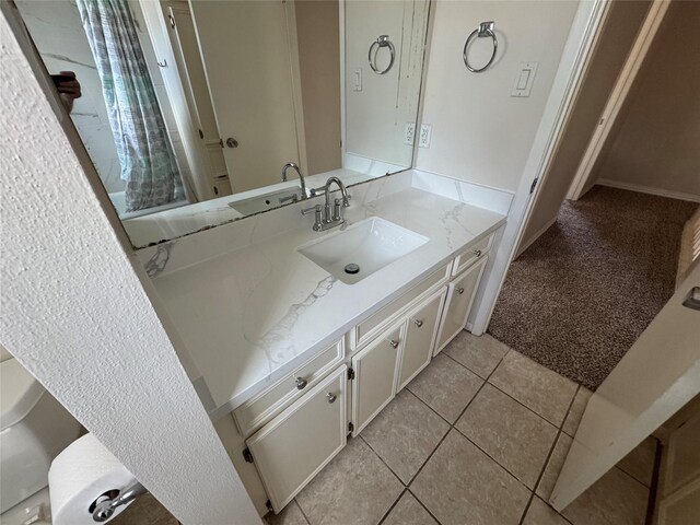 bathroom with tile patterned floors and vanity