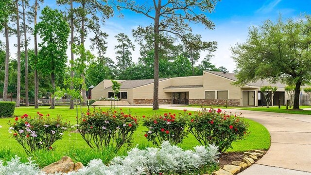 view of community featuring a lawn