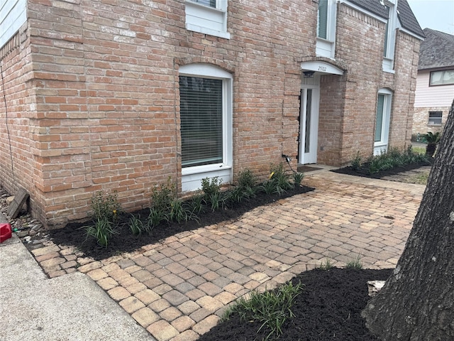 property entrance featuring a patio