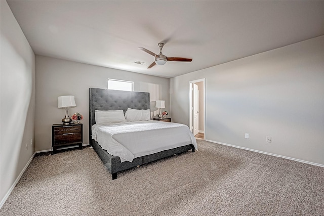 carpeted bedroom with ceiling fan, visible vents, and baseboards